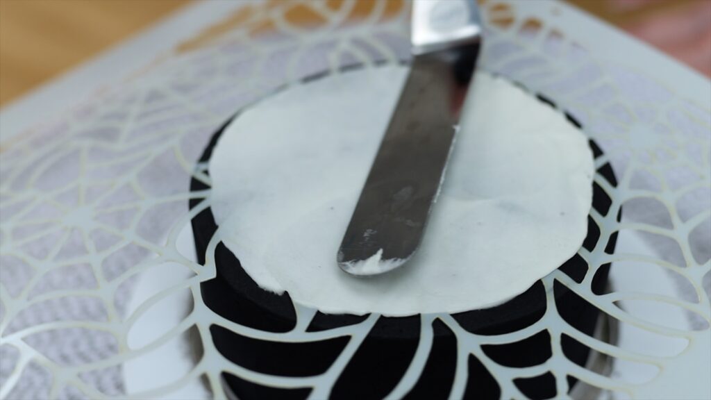 spiderweb stencil on mini halloween cake