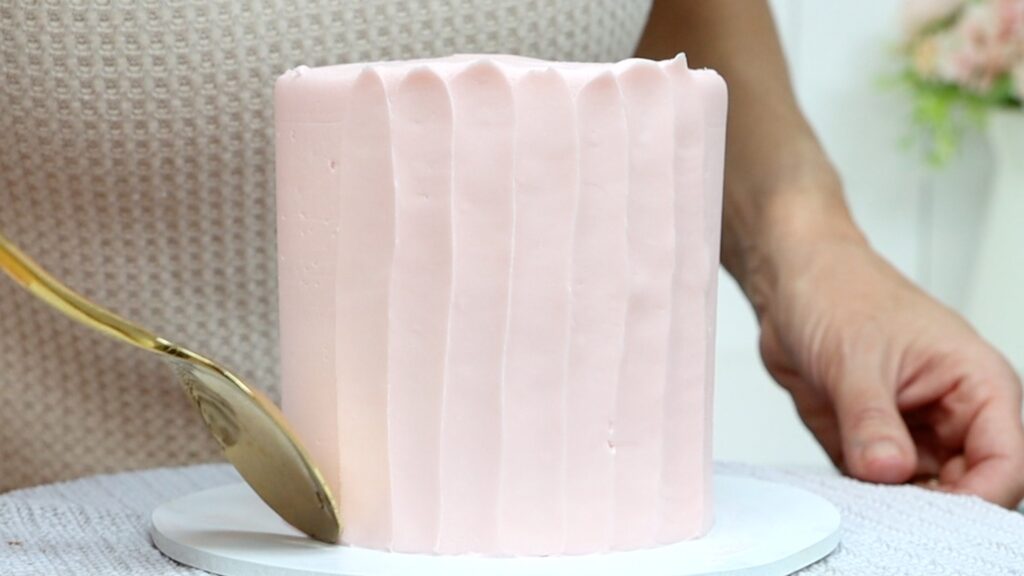 pull a spoon up the side of the cake to texture the frosting