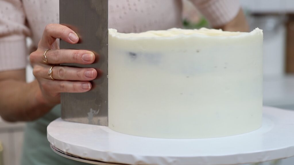 smooth frosting on semi-naked cake with metal comb