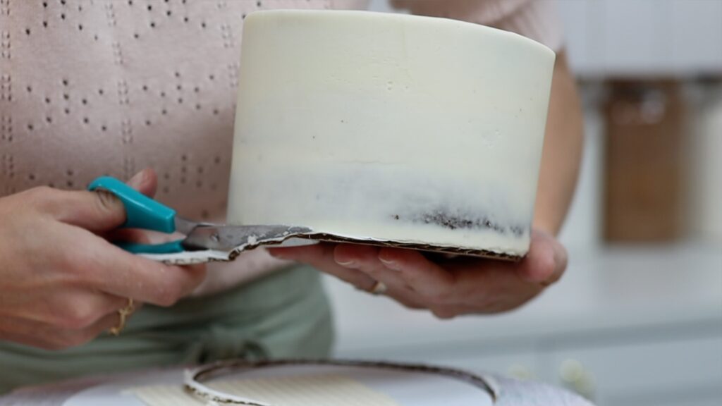 trim cake board to same size as frosted cake