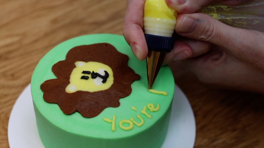 use a small piping tip for writing on cakes