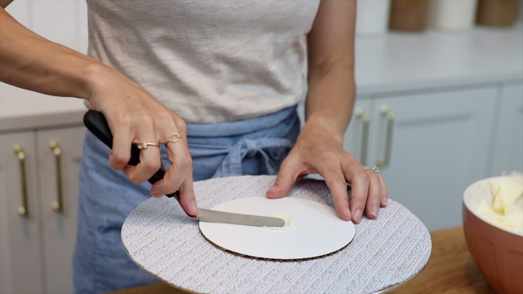 how to attach cake to cake board so it doesn't slide around