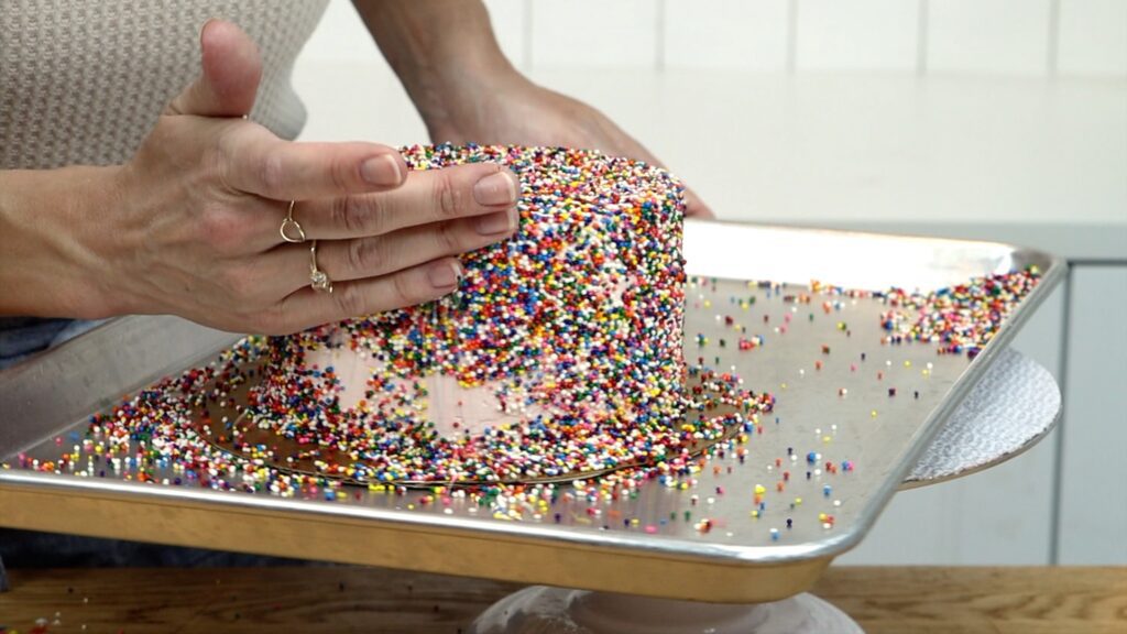 how to cover a cake with sprinkles all over