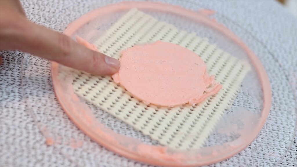 how to stick a cake to an acrylic disc so it doesn't slide around