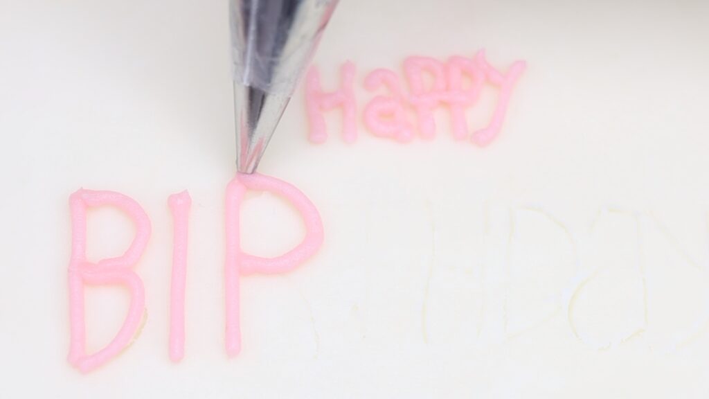 write your message with a toothpick before piping it