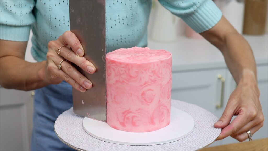 frost each cake on its own cake board before stacking tier cake