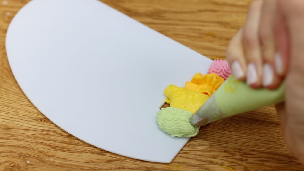 how to spread a rainbow onto a cake