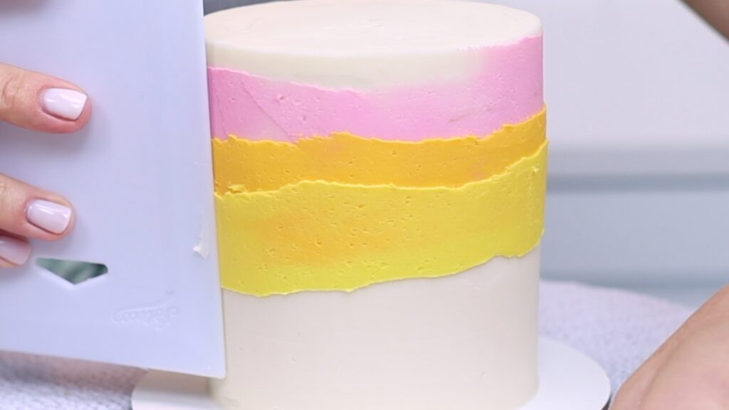 layered rainbow frosting cake