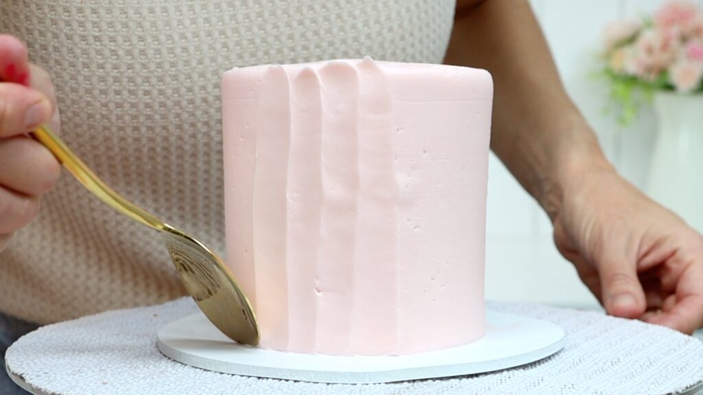 spoon textured frosting on a mother's day cake