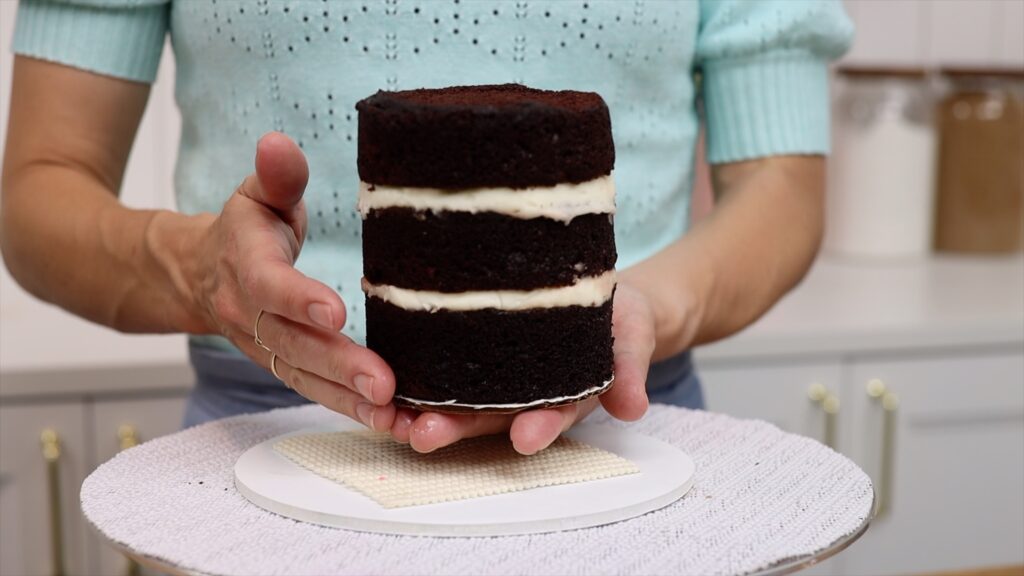 use a non slip mat in between cake boards