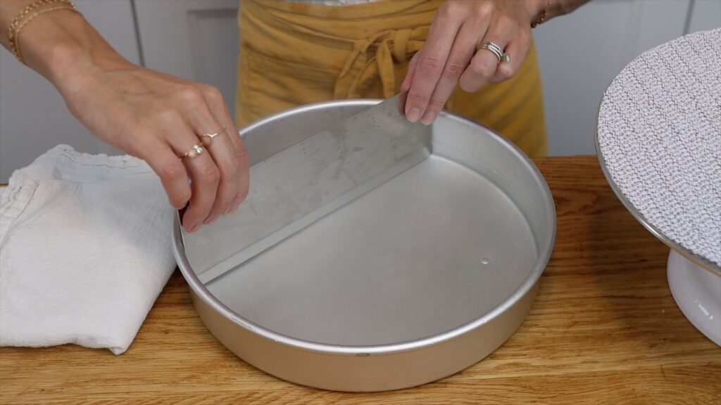 how to heat a metal cake comb to scrape and smooth frosting