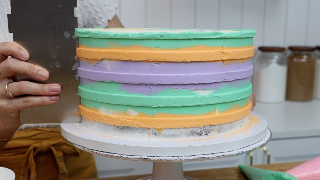 how to make rainbow stripes on a cake with buttercream frosting