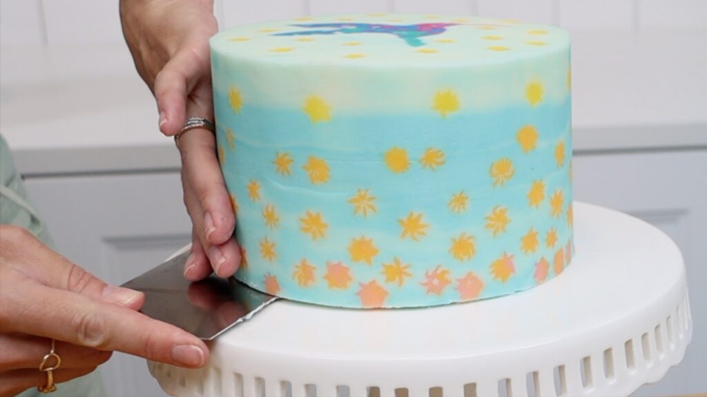 how to move a frosted cake onto a cake stand