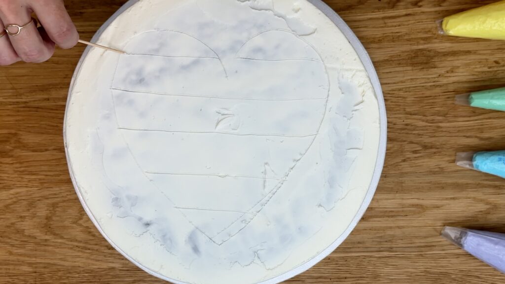 mark your shape on the cake and divide it into sections with a toothpick