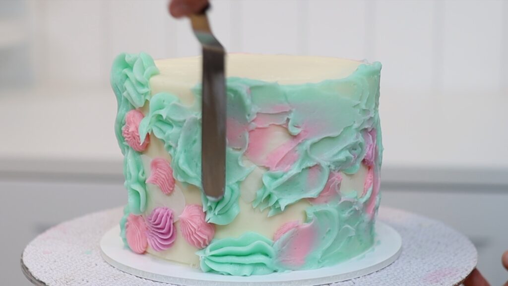 watercolour buttercream frosting on peekaboo cake