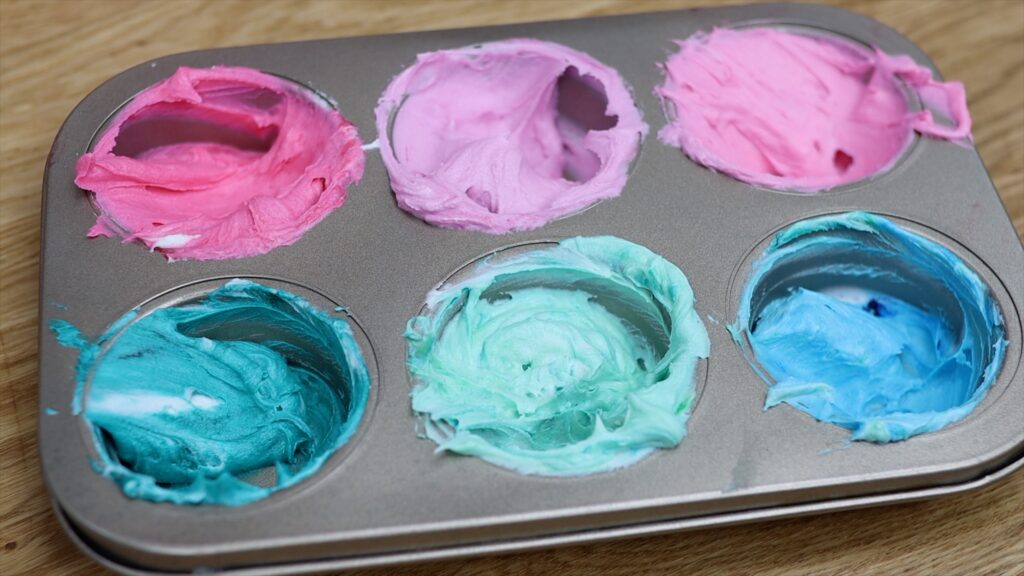 buttercream colour palette in a cupcake pan