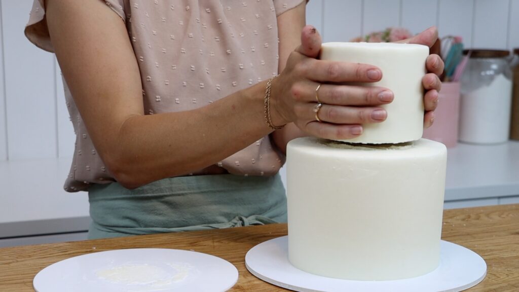 how to put a cake on top of a tier cake