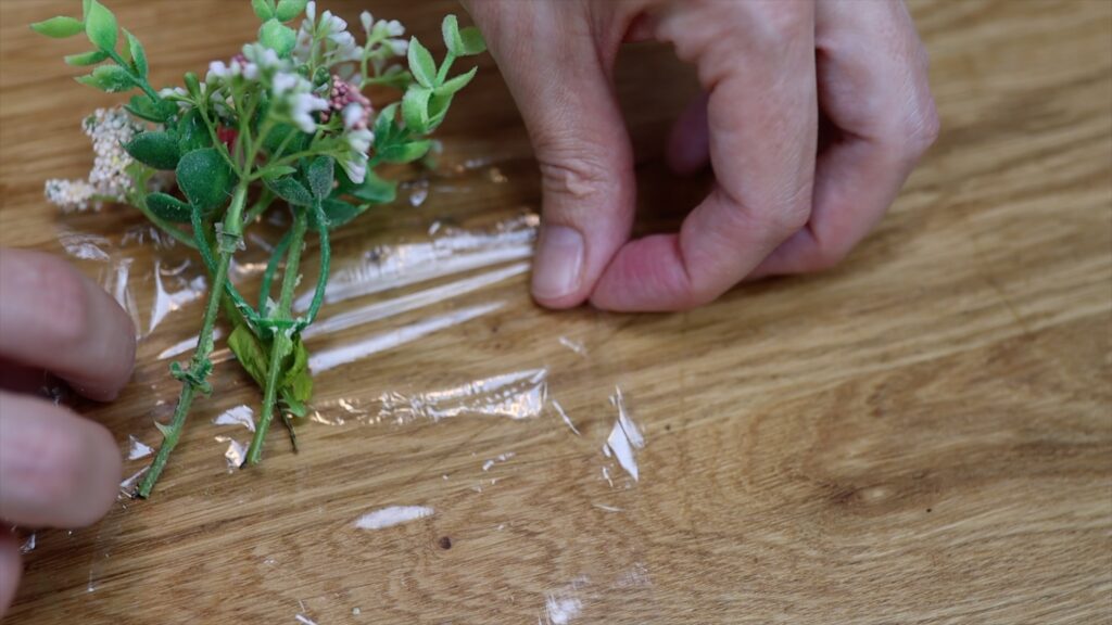 how to wrap flowers before poking them into a cake