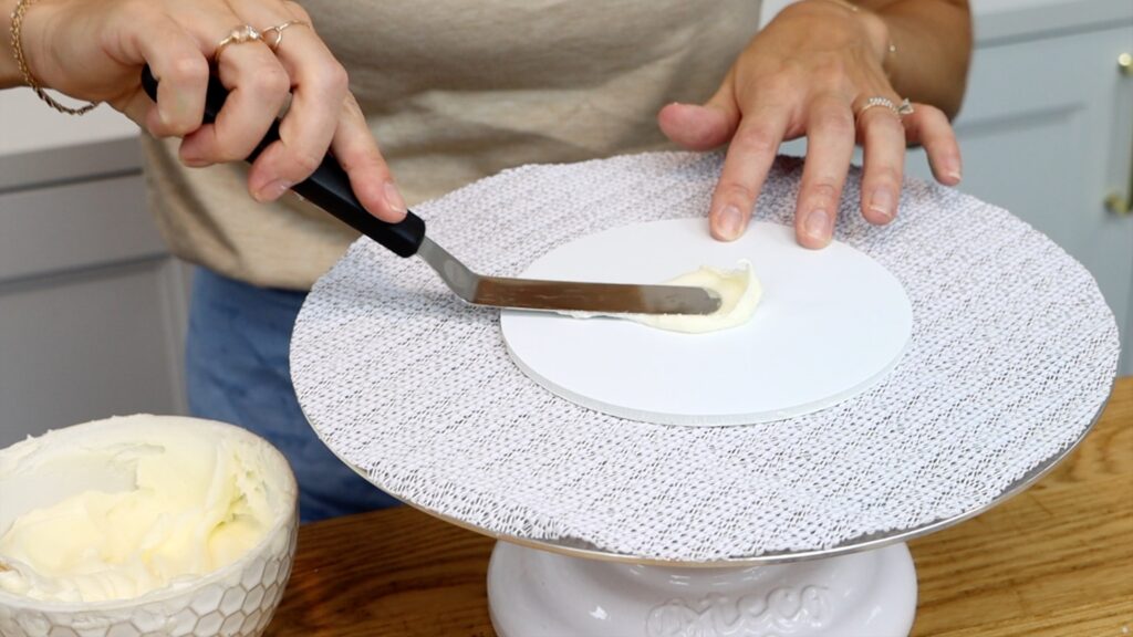 how to stick a cake to a cake board so it doesn't move