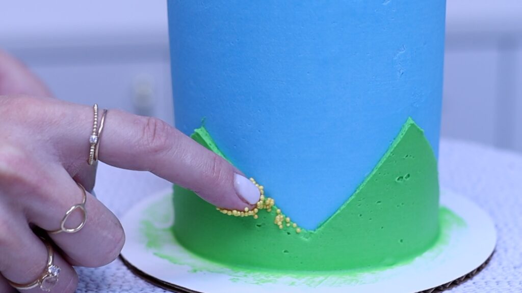 DIY sprinkle pen to attach sprinkles to a buttercream cake
