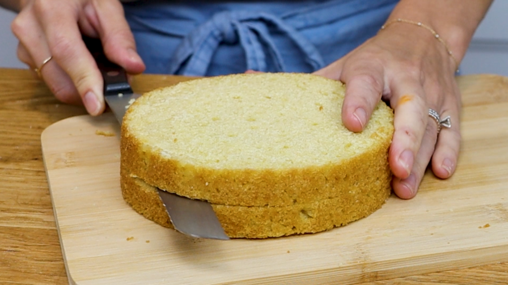 Dividing a cake layer in half with a knife