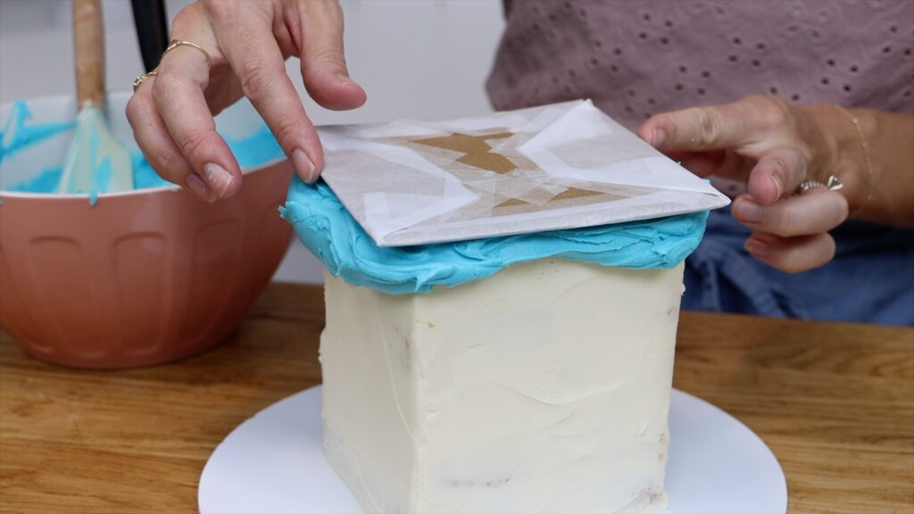 center cardboard square on top of cake