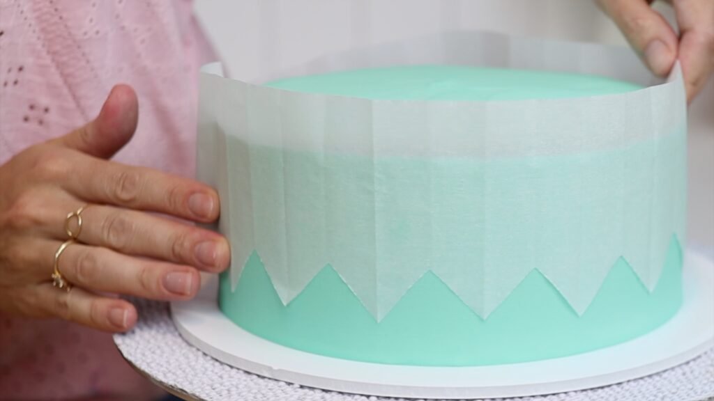 how to use parchment stencils on buttercream cakes as a DIY cake hack