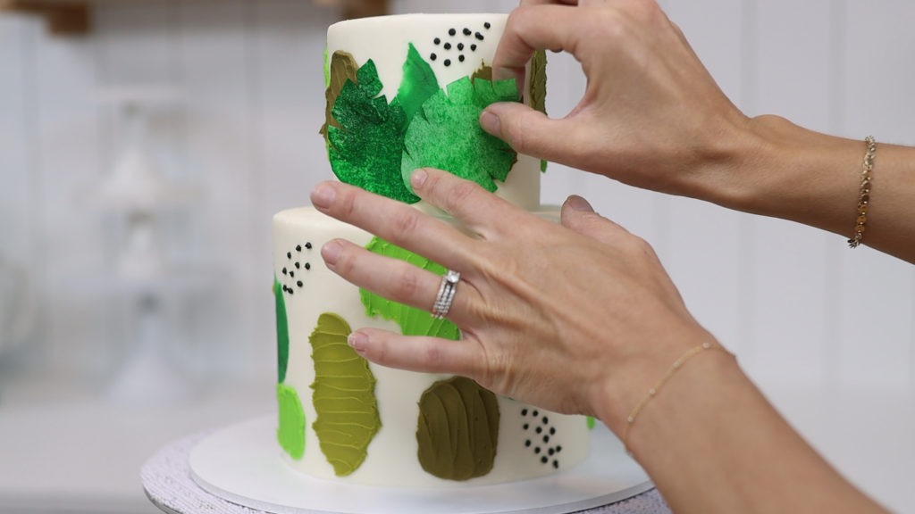 how to attach wafer paper decorations to a cake