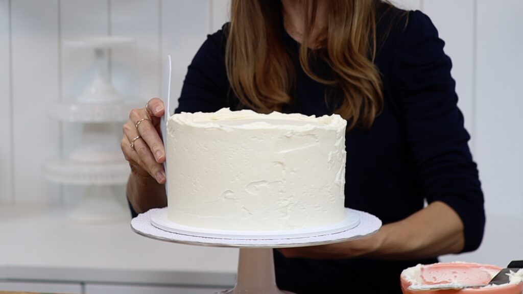 smooth frosting before using a striped cake comb