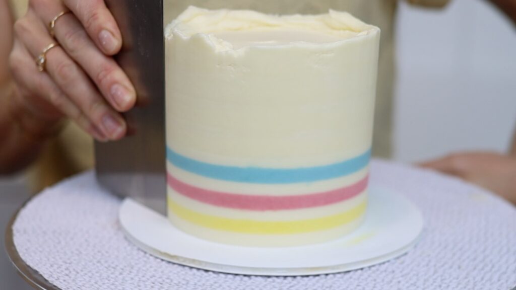 striped accents on buttercream cake