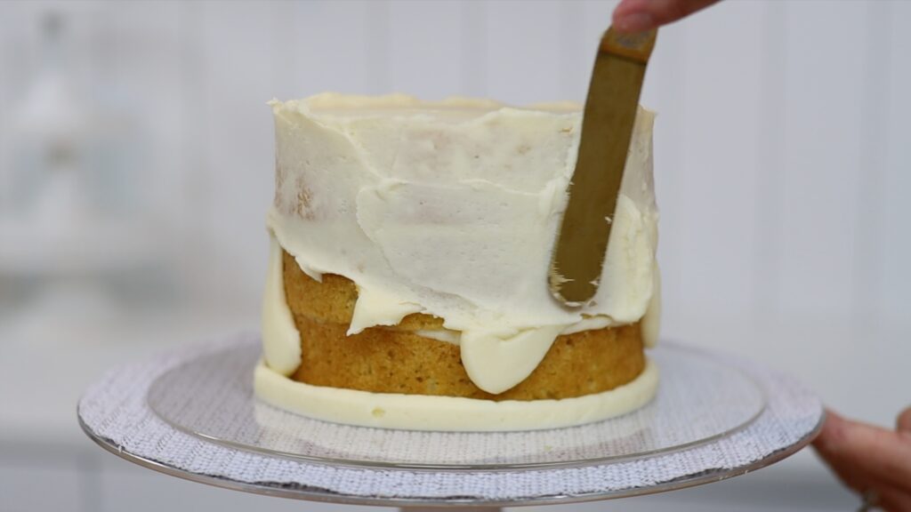 frosting cakes with piping bags