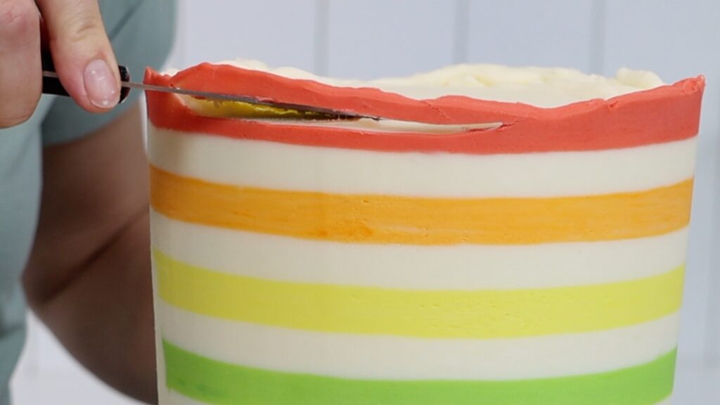 how to cut the top edge of frosting on a cake