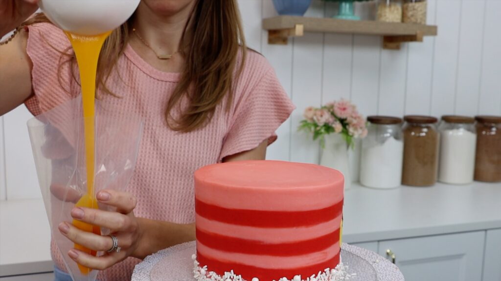 how to do a cake drip with a piping bag