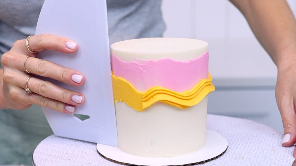 how to layer rainbow frosting on a cake