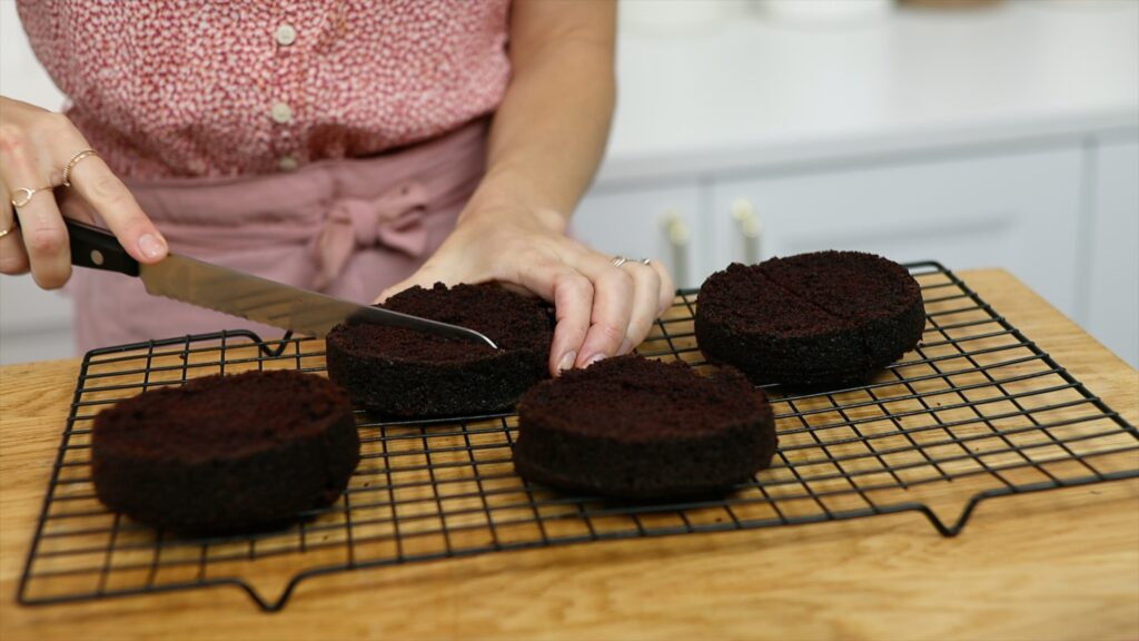 level and divide round cakes and cut in half to make semicircles to make a heart cake