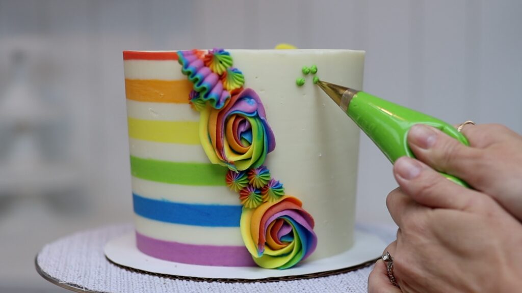 piping shamrocks onto a cake