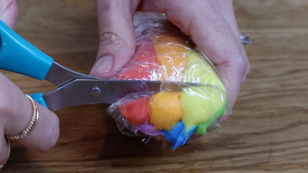 rainbow frosting in a cling film log