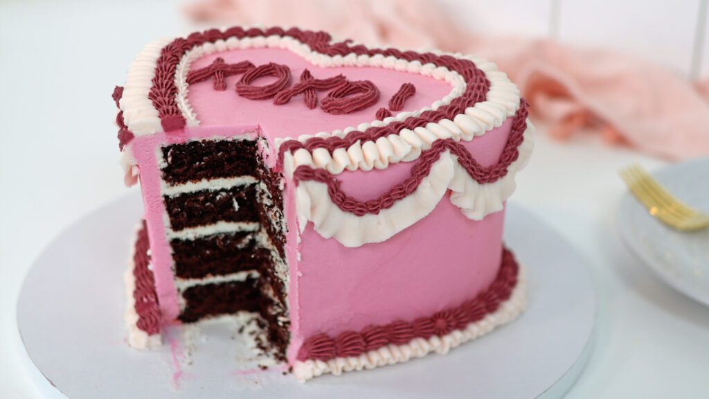 slicing a heart cake