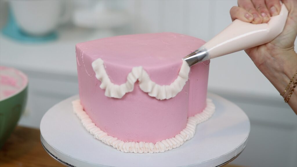 vintage piping on a heart cake