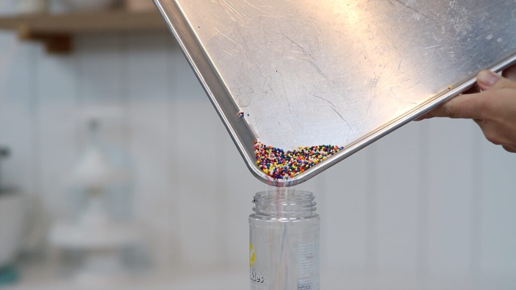 clean up sprinkles by tilting the pan and pouring the sprinkles into a jar or packet