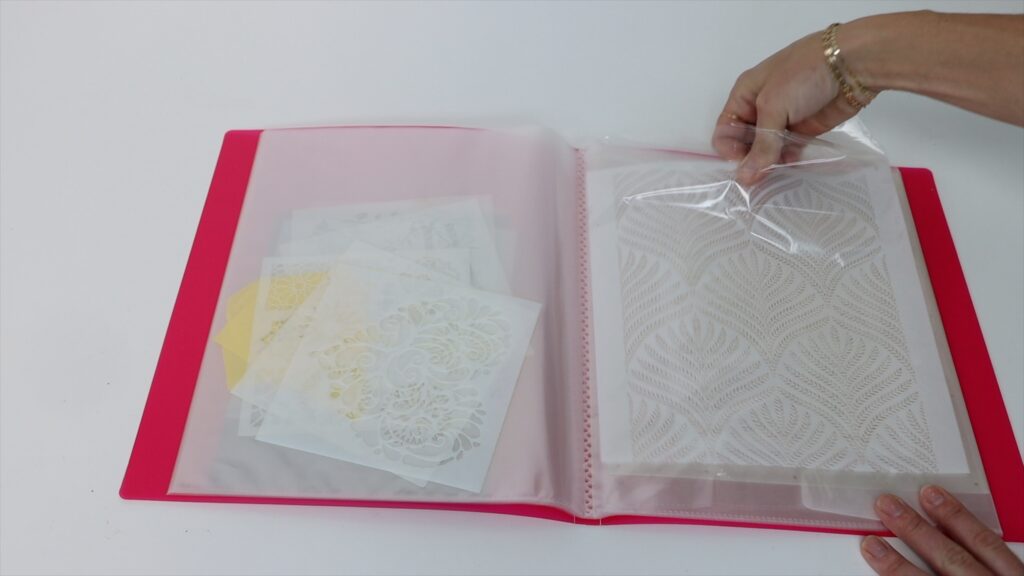 store stencils for cake decorating in a folder with clear plastic pockets