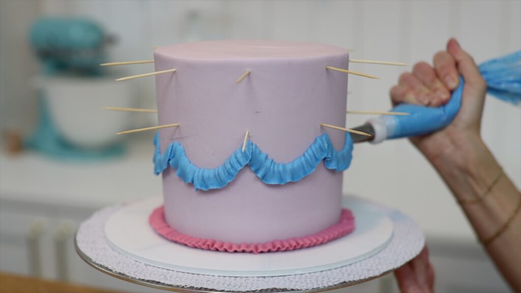 piping ruffles and swags with petal tips on vintage cakes