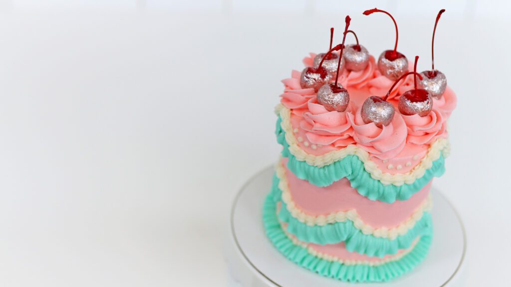 vintage cake with glittery cherry cake toppers