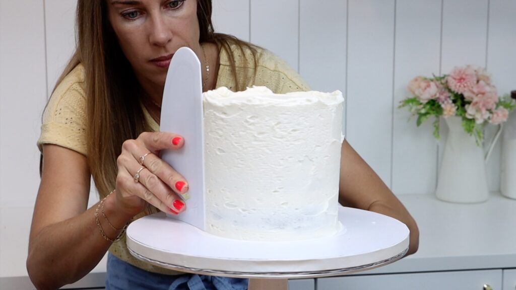 crumb coat the cake before adding the mosaic cake design