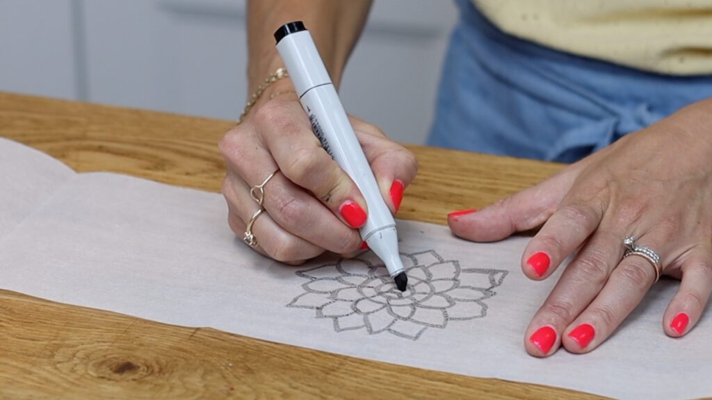 draw or trace a design using a thick pen or marker to turn into a mosaic cake