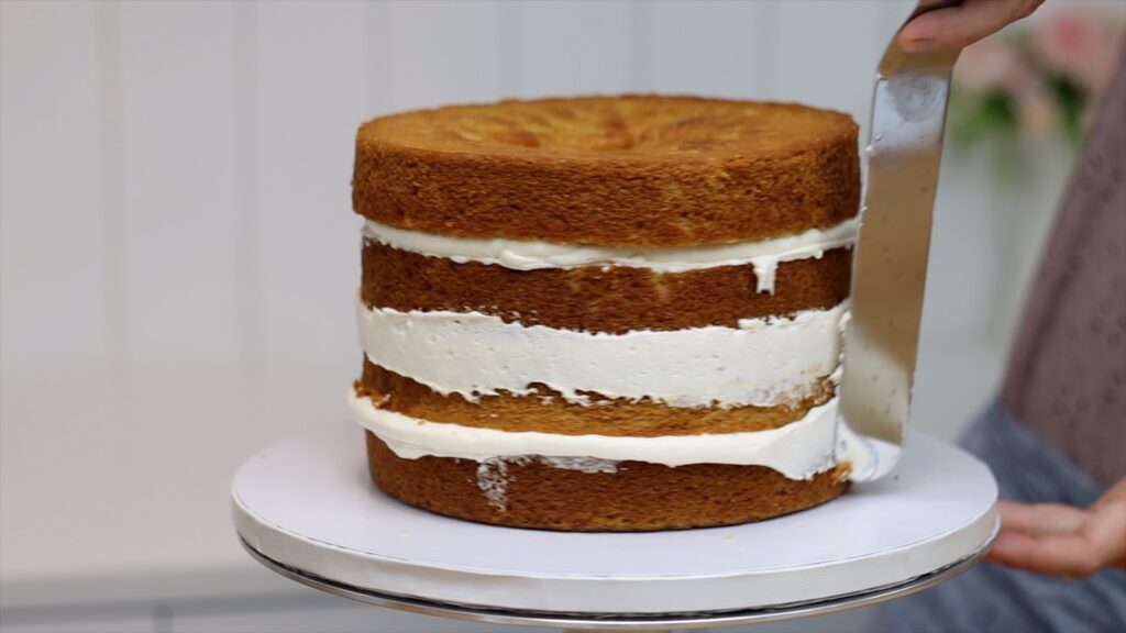 flatten filling bulges before frosting layer cakes