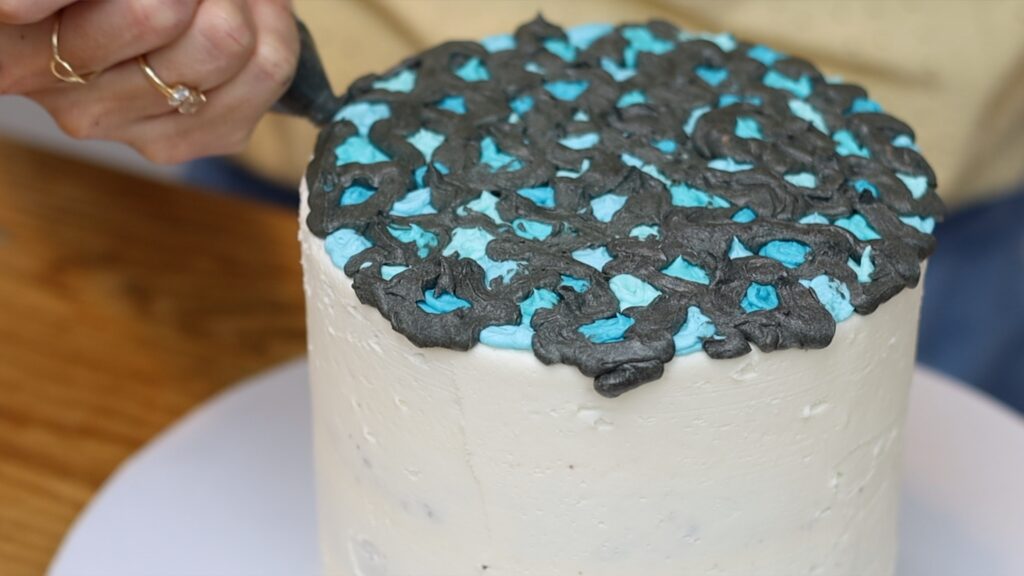 pipe grout buttercream in between the tiles on top of the mosaic cake