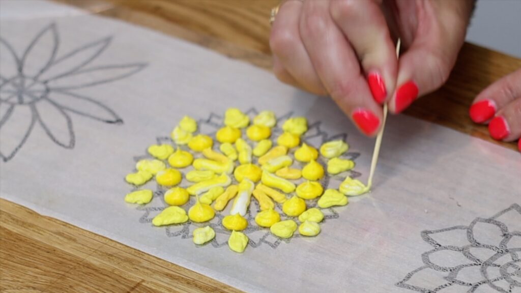 use a toothpick to make points and sharp angles in piped details