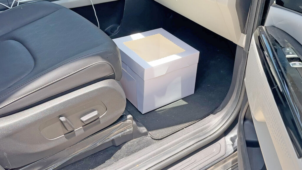 Cake box placed in car footwell using cake delivery tips
