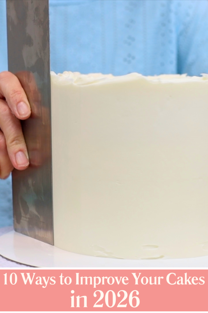 Heated cake scraper smoothing frosting and removing air bubbles